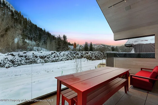 a view of a chairs and table in patio