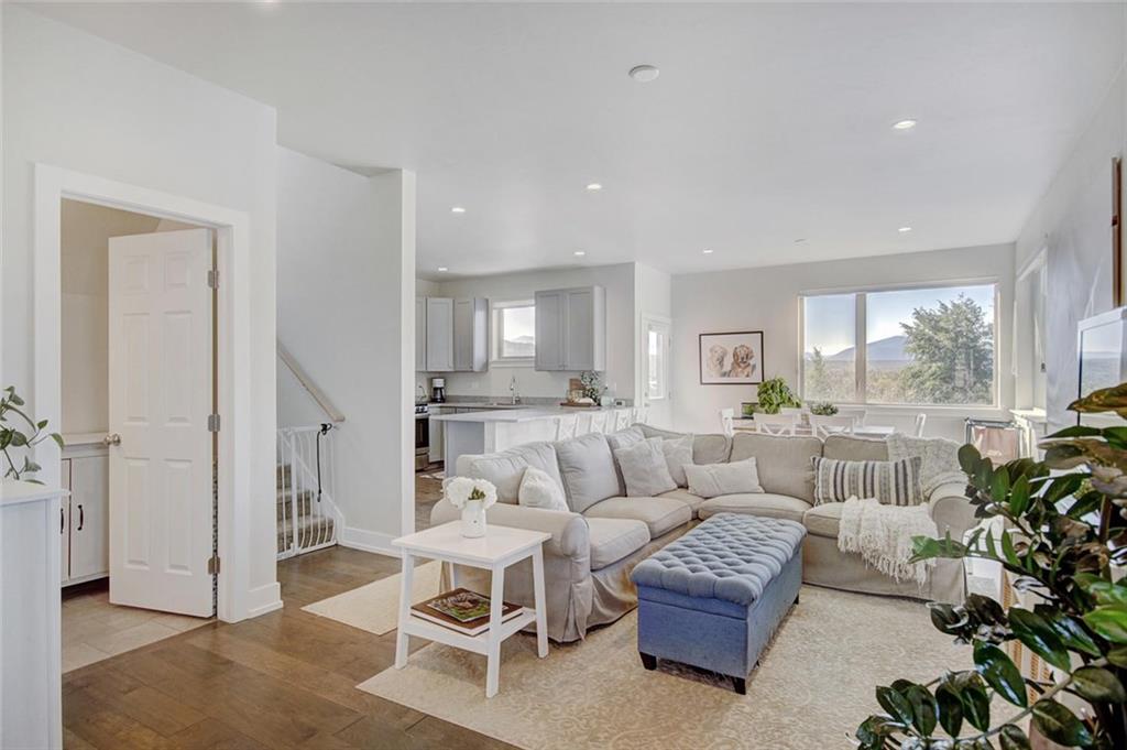 55 Haymaker Street Silverthorne, CO 80498 - Photo 2 of 27 a living room with furniture and a large window
