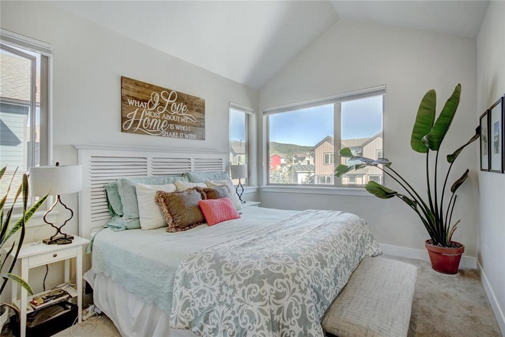 55 Haymaker Street Silverthorne, CO 80498 - Photo 14 of 27 a bedroom with a large bed and a potted plant