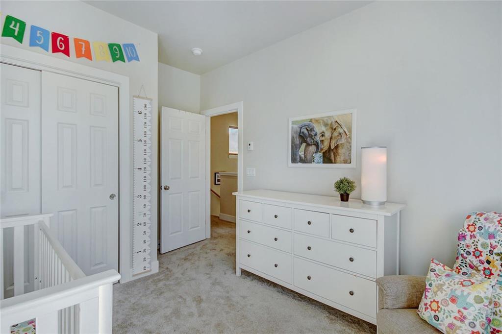 55 Haymaker Street Silverthorne, CO 80498 - Photo 18 of 27 a view of bedroom with furniture and wooden floor
