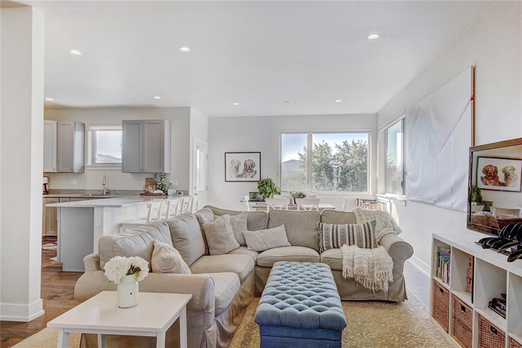 55 Haymaker Street Silverthorne, CO 80498 - Photo 3 of 27 a living room with furniture and a large window