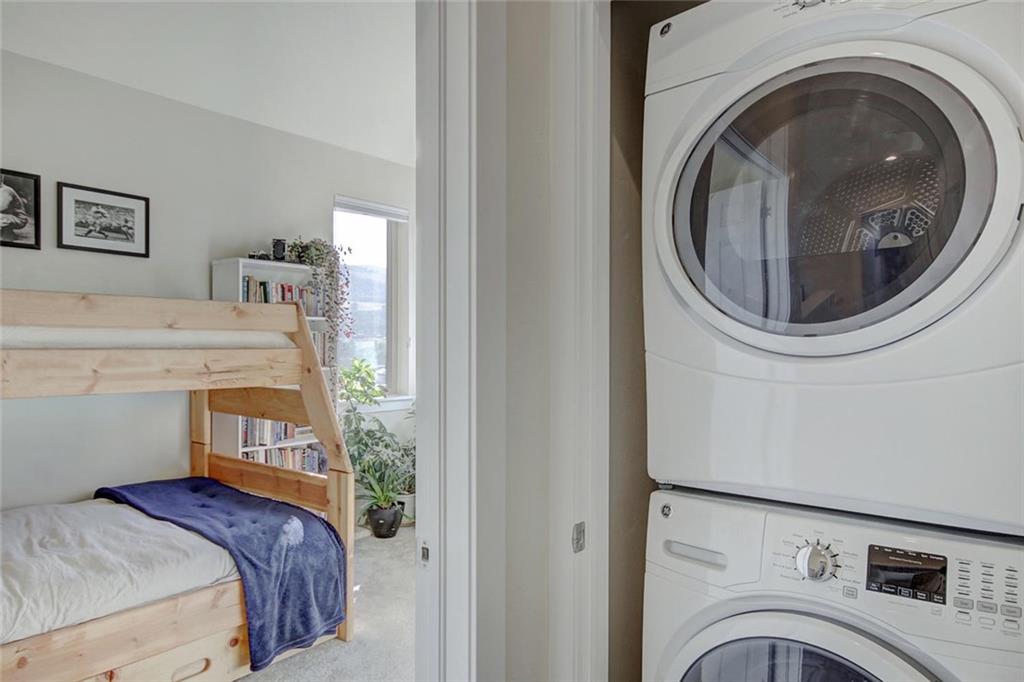 55 Haymaker Street Silverthorne, CO 80498 - Photo 21 of 27 a view of a bedroom with washer and dryer