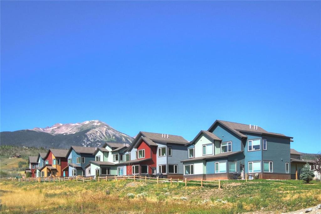 55 Haymaker Street Silverthorne, CO 80498 - Photo 27 of 27 a front view of a house with a big yard and large tree