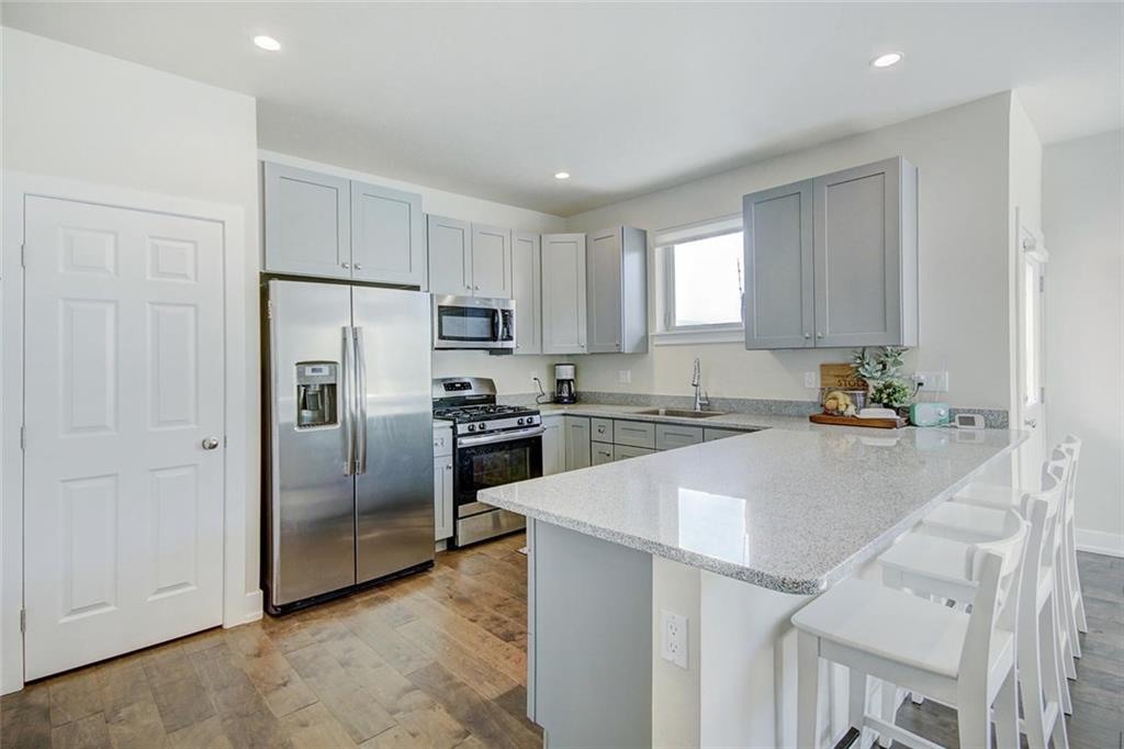 55 Haymaker Street Silverthorne, CO 80498 - Photo 10 of 27 a kitchen with granite countertop a refrigerator and a sink