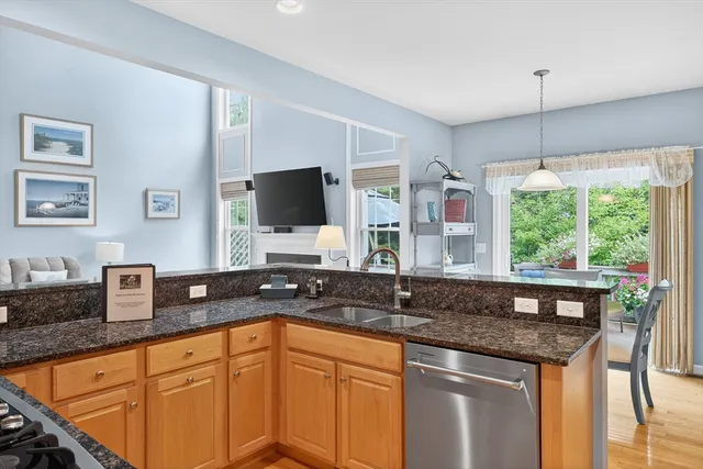 a kitchen with granite countertop a sink and a granite counter tops