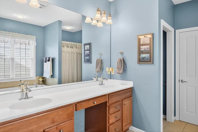 a bathroom with a sink double vanity and a mirror