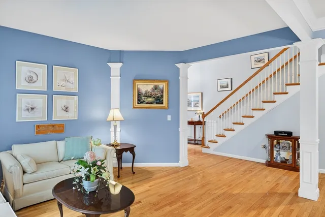 a living room with furniture and a lamp