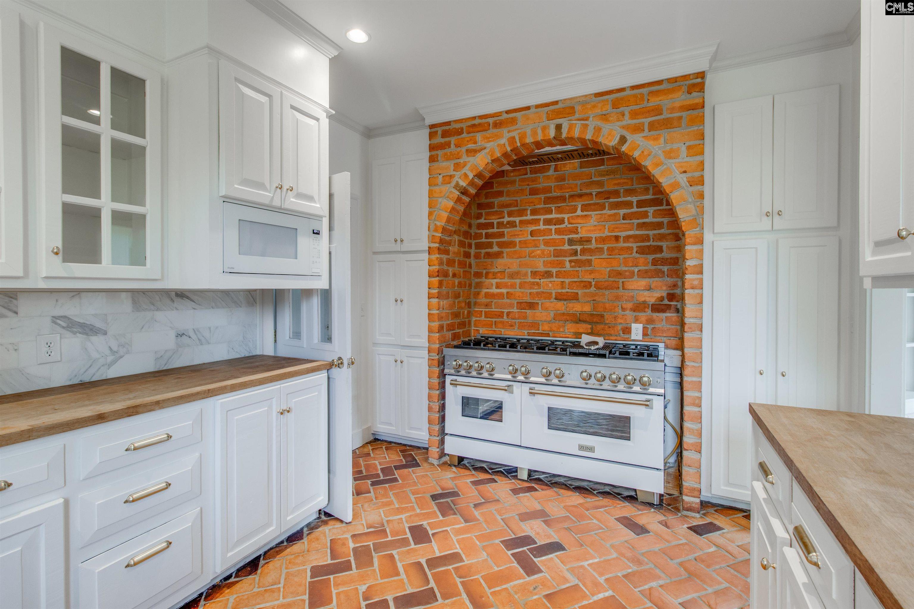 701 Longtown Road Columbia, SC 29229 - Photo 6 of 26 a kitchen with stainless steel appliances granite countertop a stove a sink and a microwave
