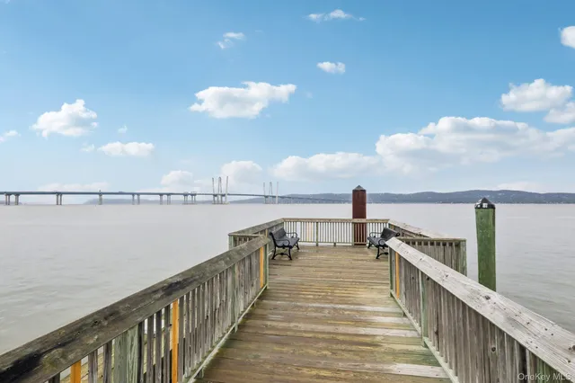 a view of a patio with furniture and a yard