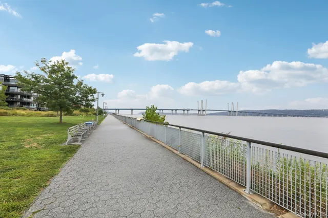 a view of an entrance to house with yard