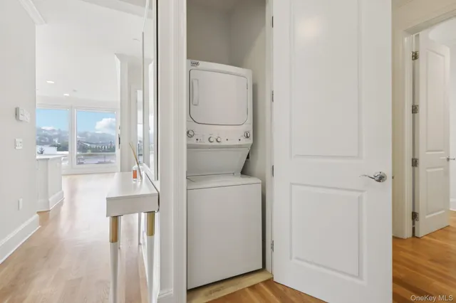 a view of bathroom with a toilet a sink and a mirror