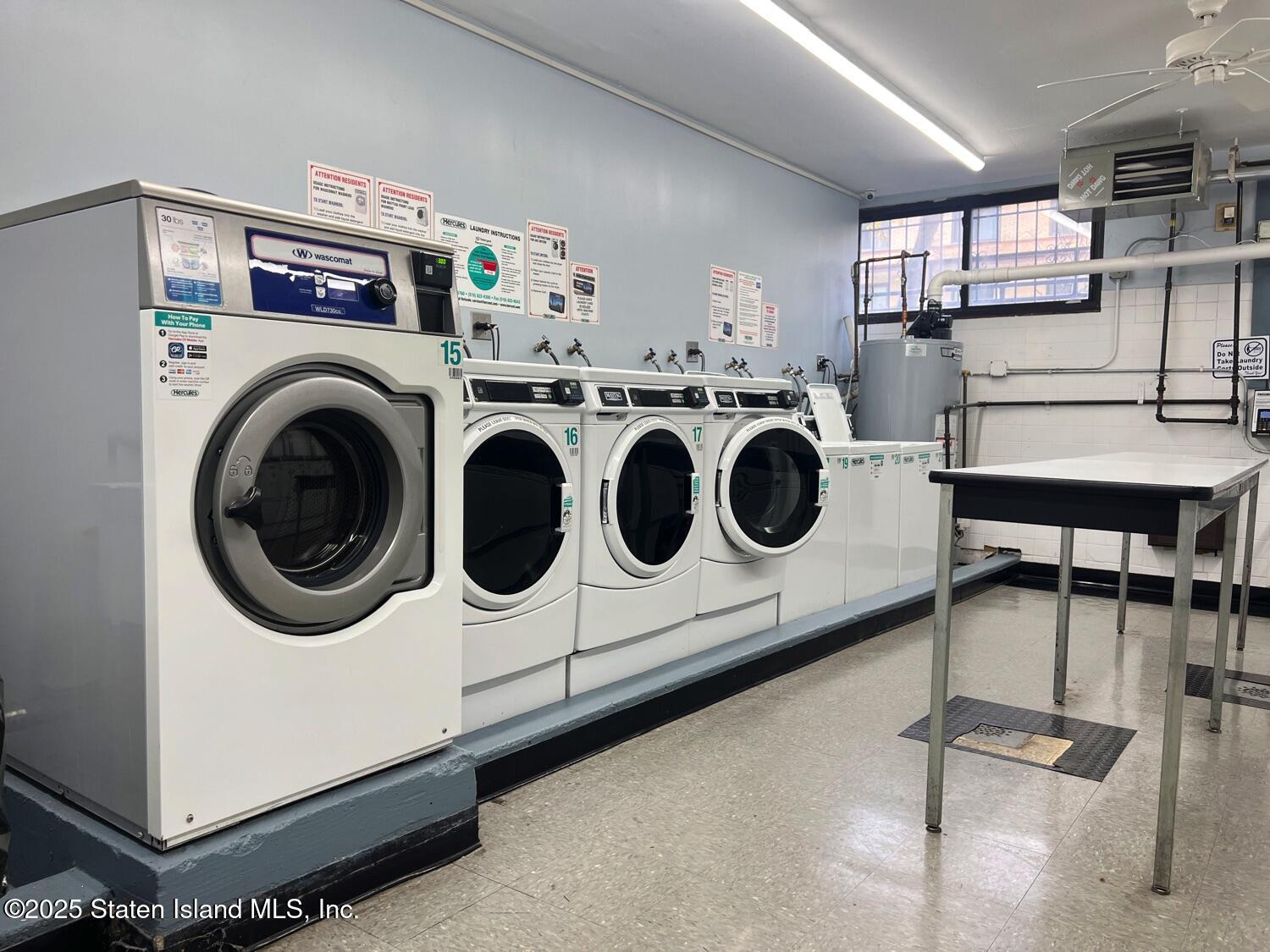11 Windham Loop, Unit 1NN Staten Island, NY 10314 - Photo 19 of 25 a utility room with dryer and washer