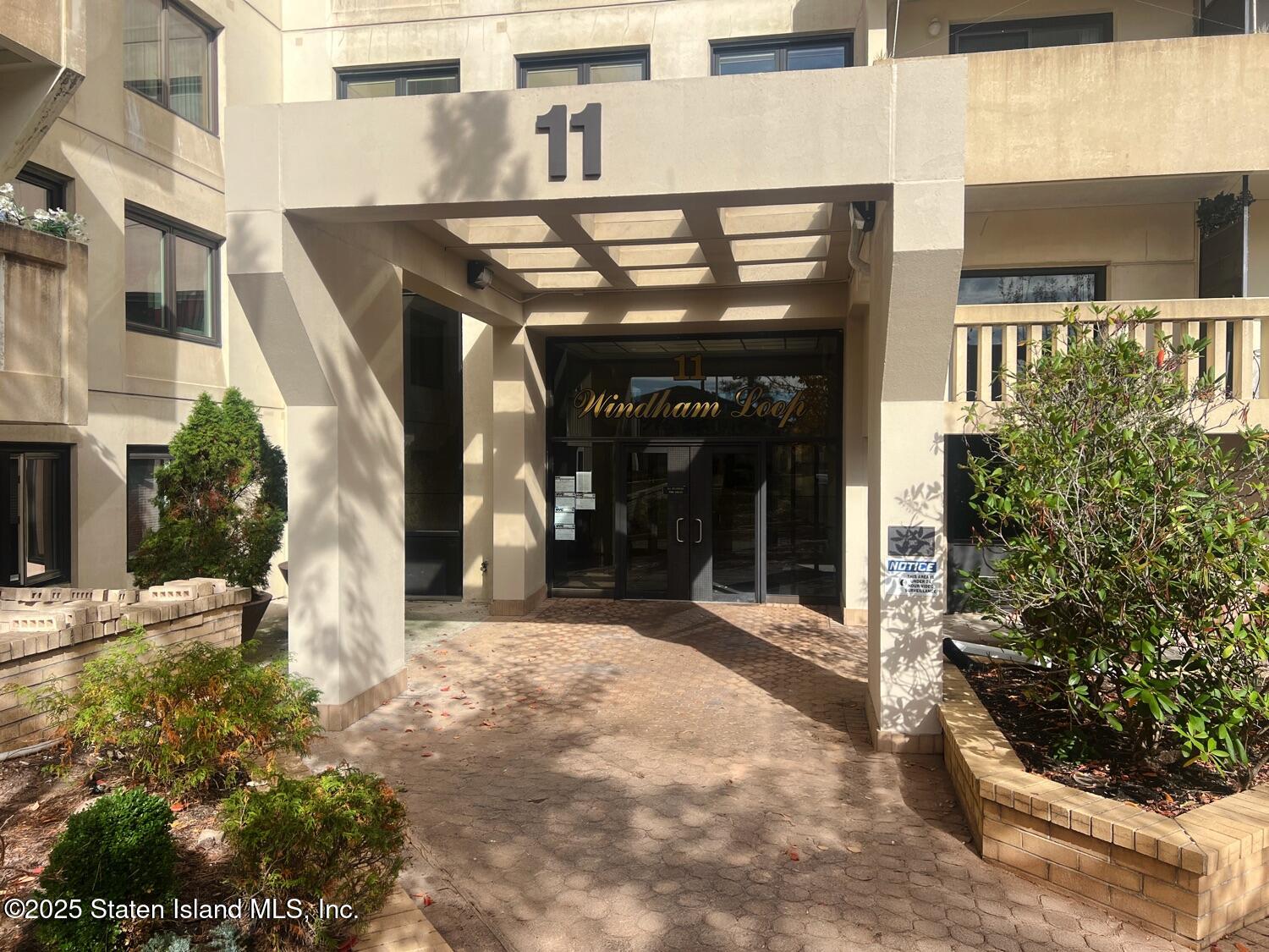 11 Windham Loop, Unit 1NN Staten Island, NY 10314 - Photo 2 of 25 a view of a building with pots