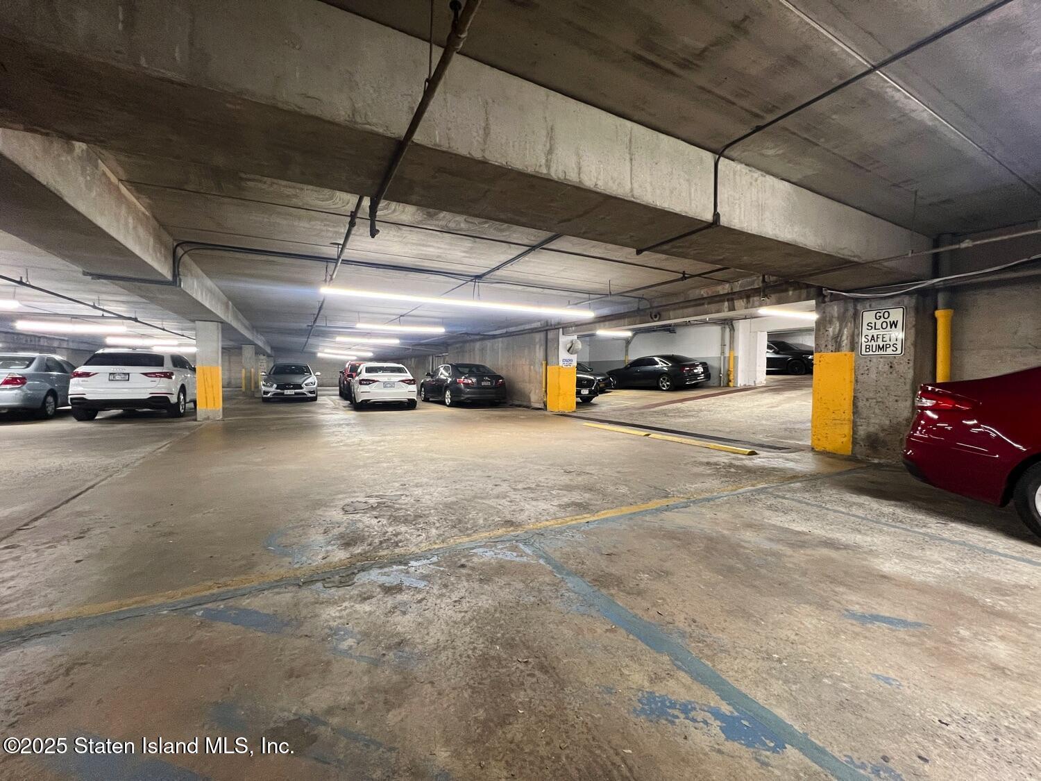 11 Windham Loop, Unit 1NN Staten Island, NY 10314 - Photo 21 of 25 a view of parking garage with cars