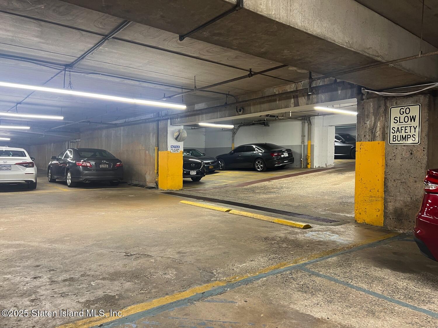 11 Windham Loop, Unit 1NN Staten Island, NY 10314 - Photo 22 of 25 a view of parking garage with cars