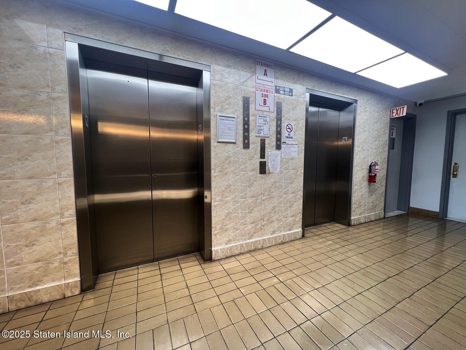11 Windham Loop, Unit 1NN Staten Island, NY 10314 - Photo 4 of 25 a view of a refrigerator in kitchen and an empty room