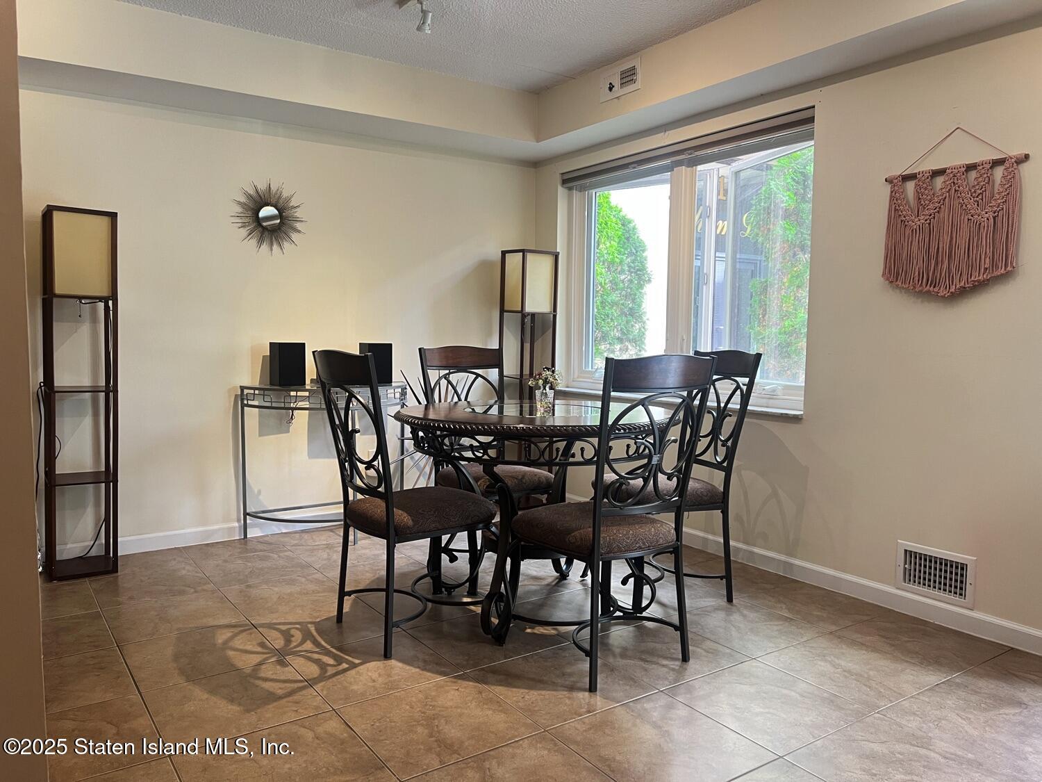 11 Windham Loop, Unit 1NN Staten Island, NY 10314 - Photo 7 of 25 a view of a dining room with furniture and window
