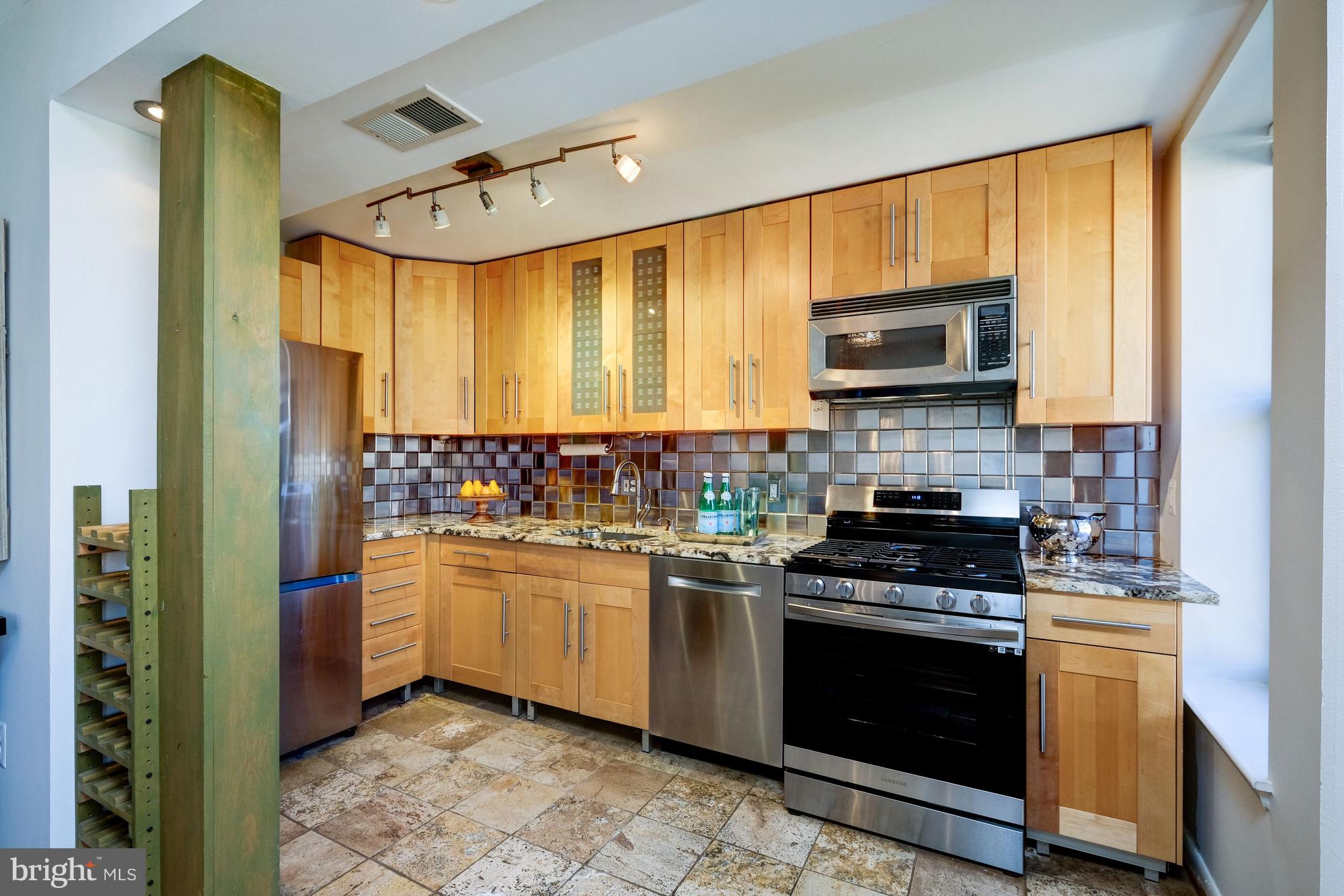 2633 Adams Mill Road Northwest, Unit 401 Washington, DC 20009 - Photo 8 of 27 Stylish open kitchen with wine storage