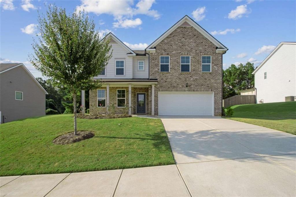 429 Paxton Lane Jefferson, GA 30549 - Photo 1 of 53 a front view of a house with a yard and garage