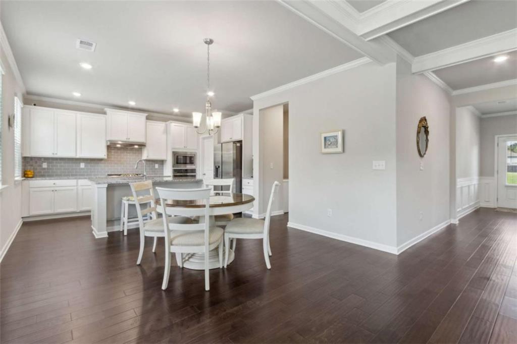 429 Paxton Lane Jefferson, GA 30549 - Photo 18 of 53 a view of a dining room with furniture and wooden floor