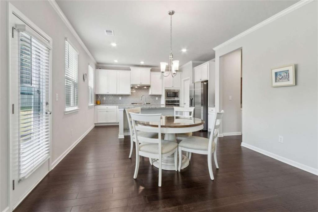 429 Paxton Lane Jefferson, GA 30549 - Photo 19 of 53 a view of a dining room with furniture window and wooden floor