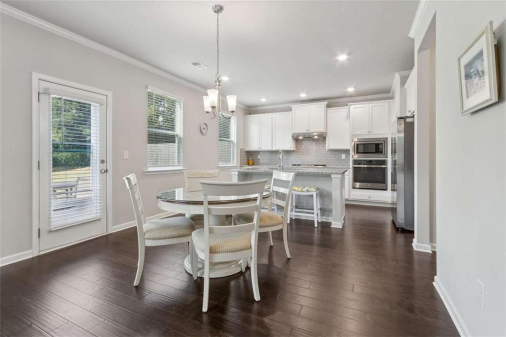 429 Paxton Lane Jefferson, GA 30549 - Photo 20 of 53 a view of a dining room with furniture window and wooden floor