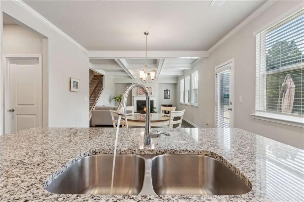 429 Paxton Lane Jefferson, GA 30549 - Photo 29 of 53 a kitchen with a faucet a sink and chandelier