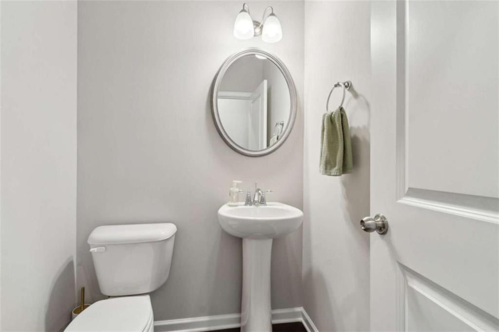 429 Paxton Lane Jefferson, GA 30549 - Photo 30 of 53 a bathroom with a toilet sink and mirror