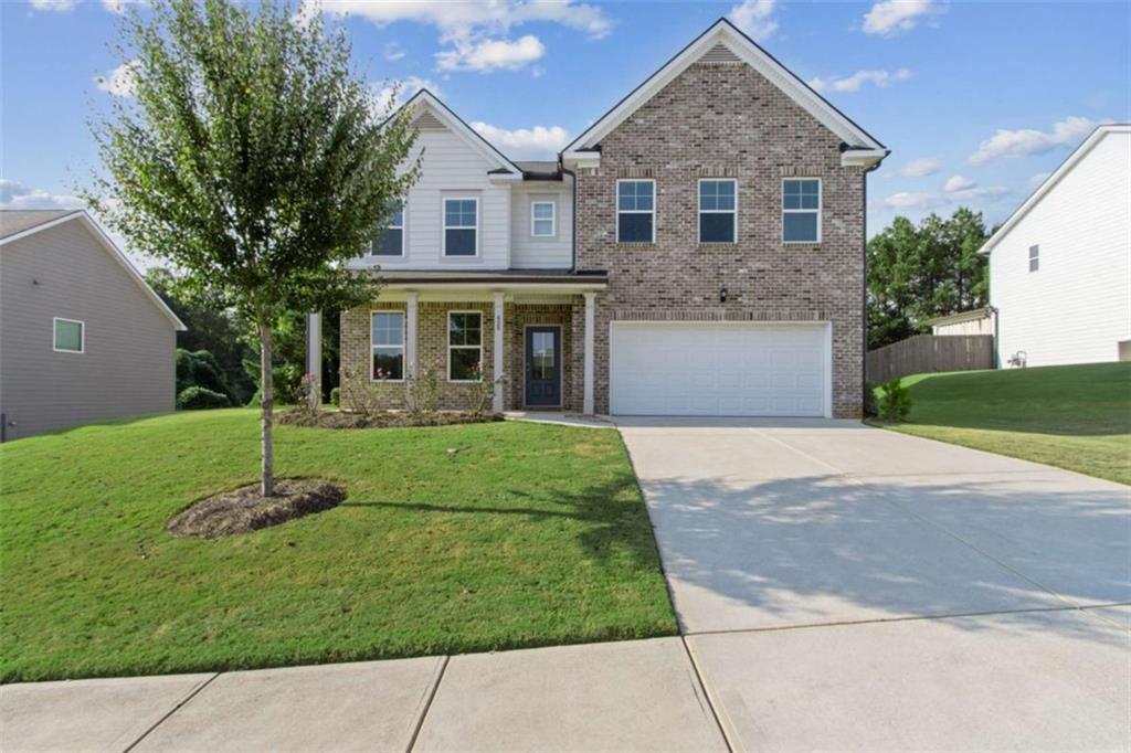 429 Paxton Lane Jefferson, GA 30549 - Photo 3 of 53 a front view of a house with a yard