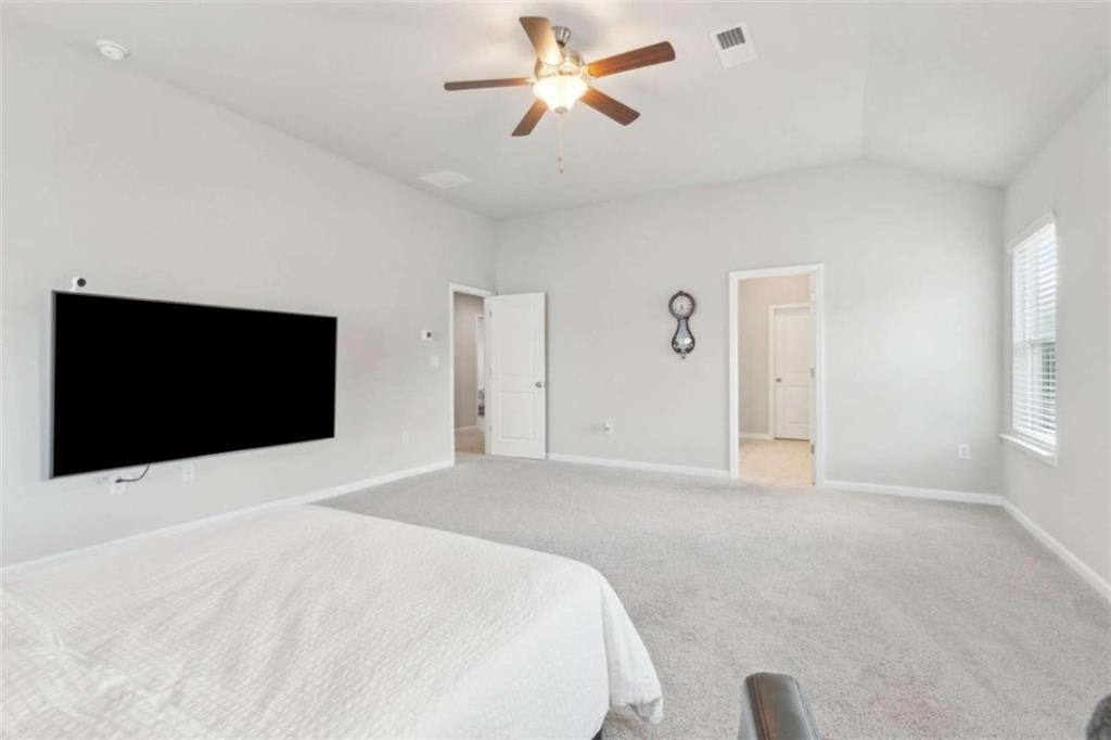 429 Paxton Lane Jefferson, GA 30549 - Photo 34 of 53 a bedroom with a bed and a flat screen tv