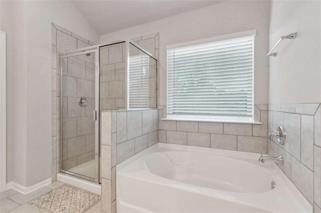 429 Paxton Lane Jefferson, GA 30549 - Photo 36 of 53 a white bath tub sitting next to a shower