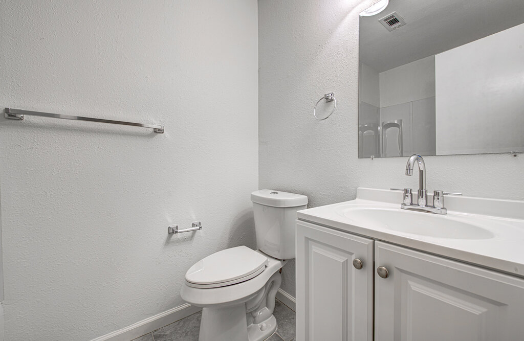 1306 Bonnie Brae Street, Unit B Austin, TX 78753 - Photo 13 of 28 a bathroom with a sink toilet and vanity