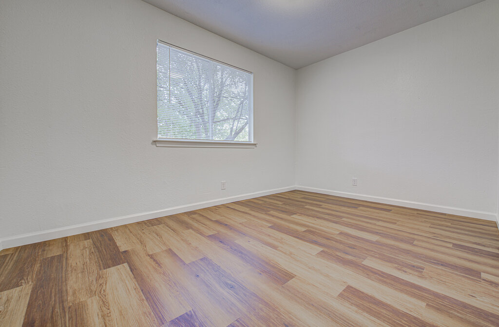 1306 Bonnie Brae Street, Unit B Austin, TX 78753 - Photo 14 of 28 a view of empty room with wooden floor