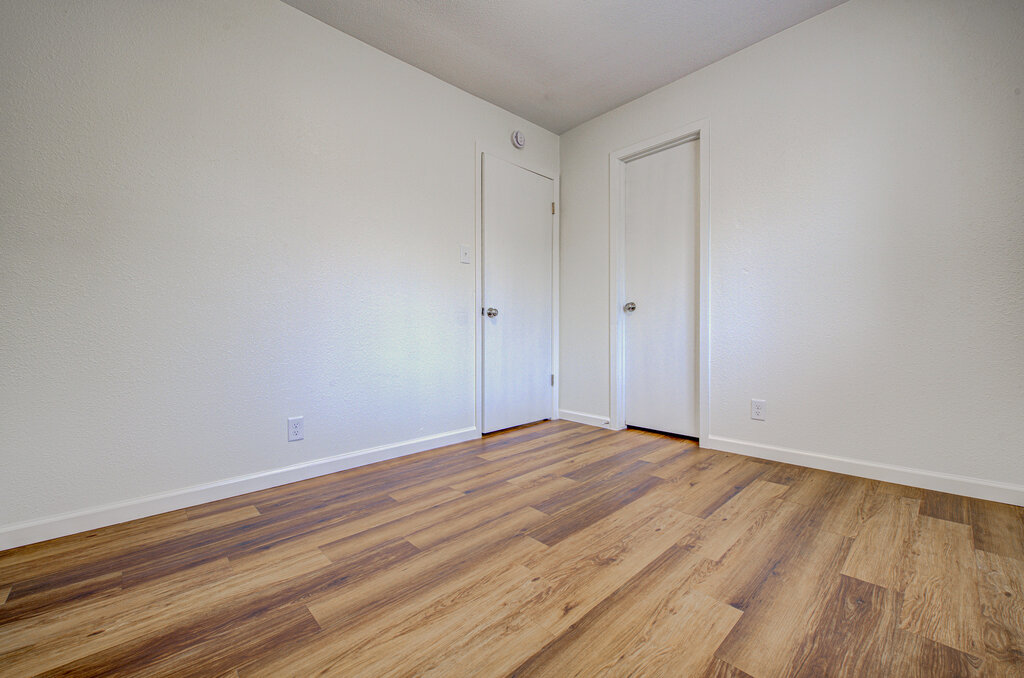 1306 Bonnie Brae Street, Unit B Austin, TX 78753 - Photo 17 of 28 a view of an empty room with wooden floor