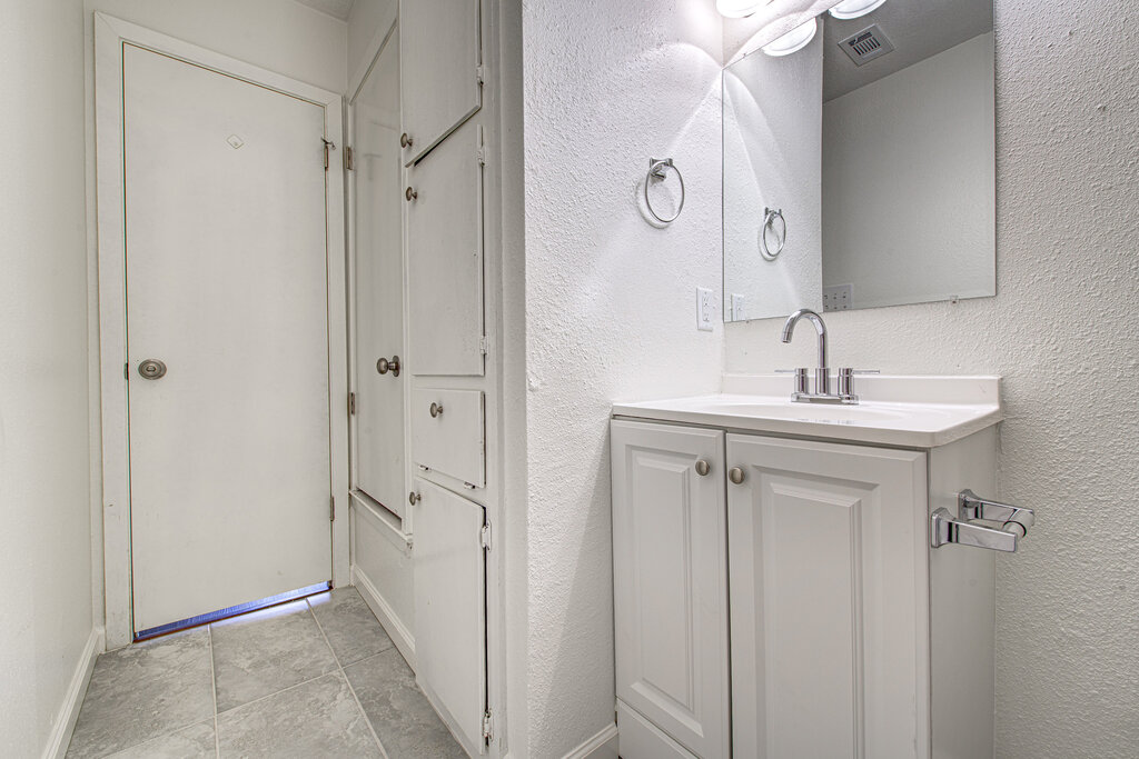 1306 Bonnie Brae Street, Unit B Austin, TX 78753 - Photo 22 of 28 a bathroom with a sink mirror and shower