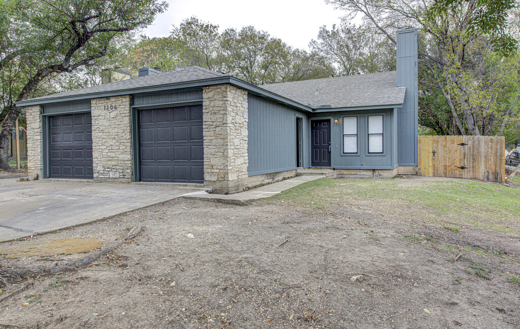 1306 Bonnie Brae Street, Unit B Austin, TX 78753 - Photo 24 of 28 front view of a house with a yard