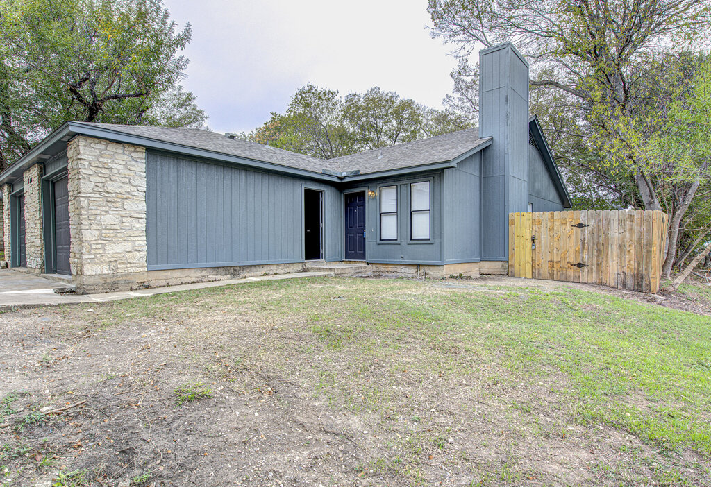 1306 Bonnie Brae Street, Unit B Austin, TX 78753 - Photo 25 of 28 a house with trees in the background