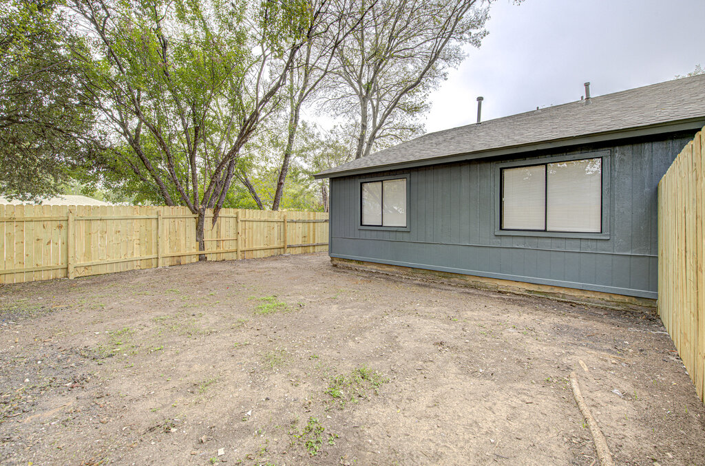 1306 Bonnie Brae Street, Unit B Austin, TX 78753 - Photo 27 of 28 a house with trees in the background