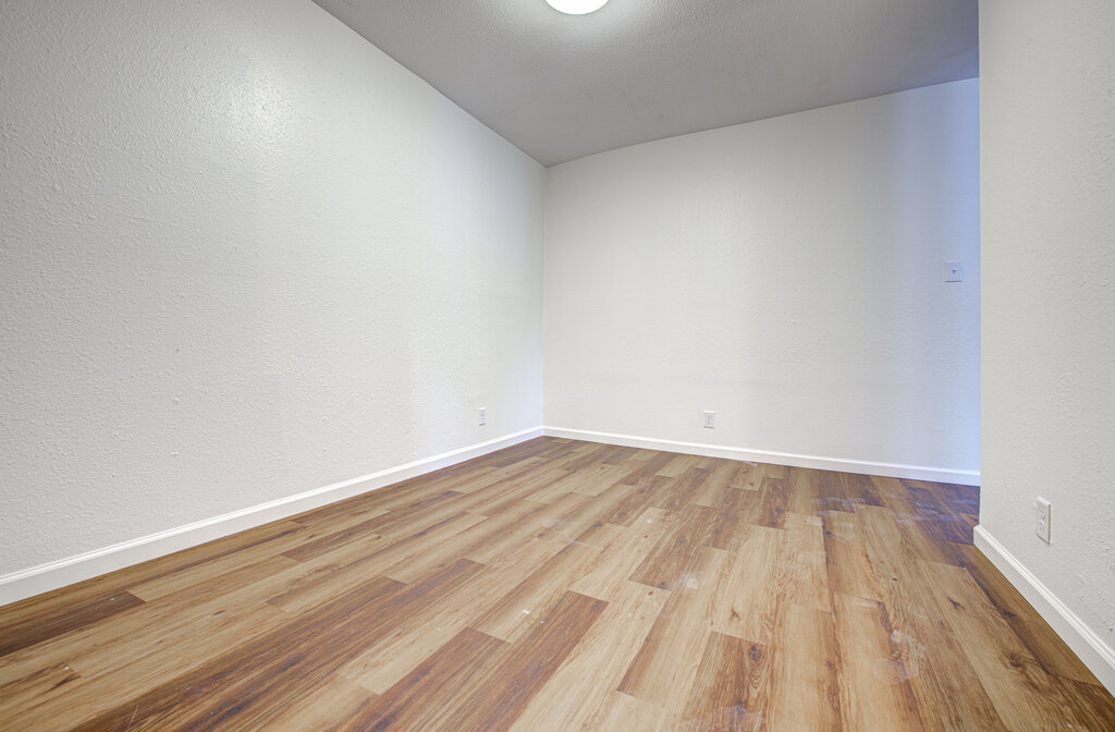 1306 Bonnie Brae Street, Unit B Austin, TX 78753 - Photo 4 of 28 a view of an empty room and wooden floor