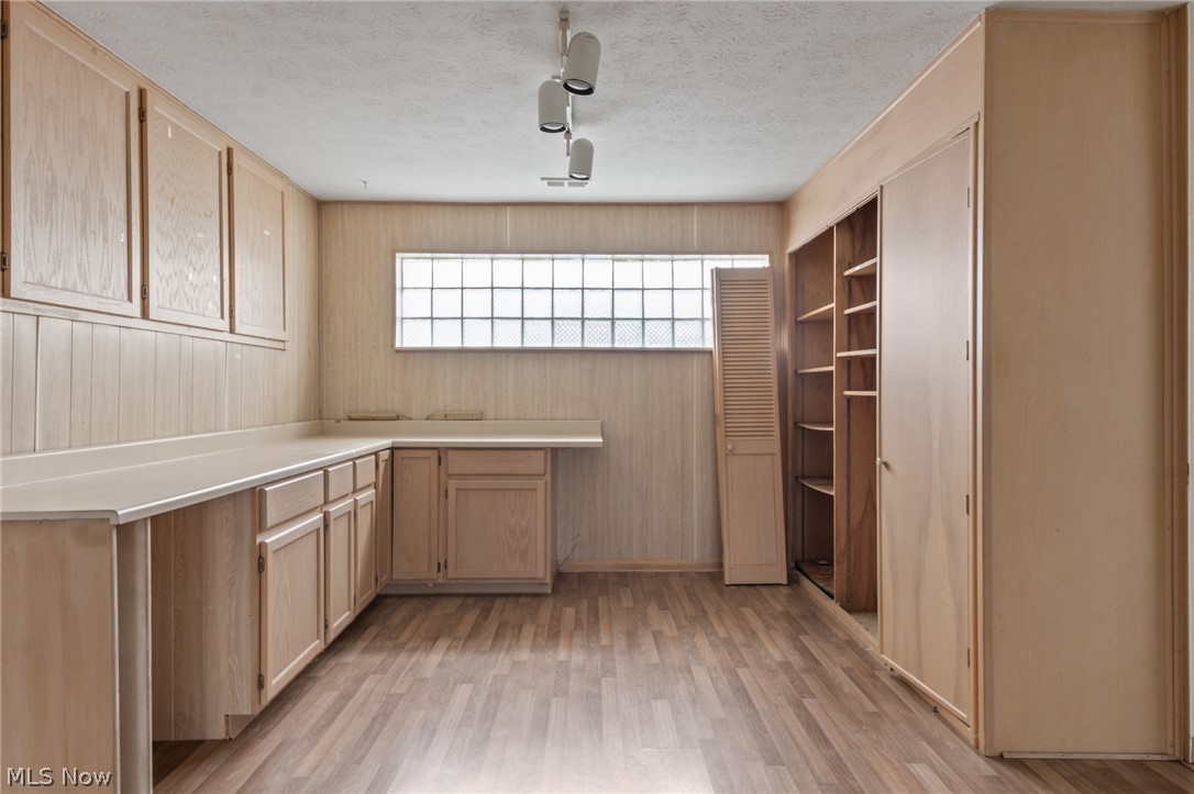 28879 Ridge Road Wickliffe, OH 44092 - Photo 22 of 34 Kitchen with light brown cabinetry, a textured ceiling, and light wood-type flooring