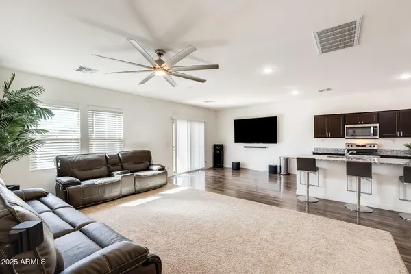 a living room with furniture and a large window