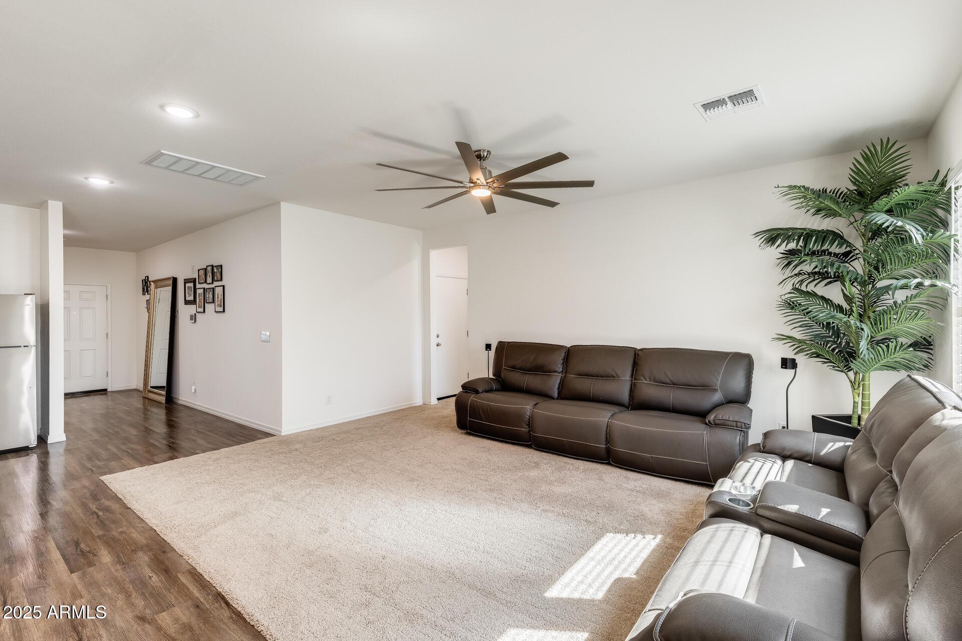 5663 East Moira Road Florence, AZ 85132 - Photo 14 of 37 a living room with furniture and a chandelier