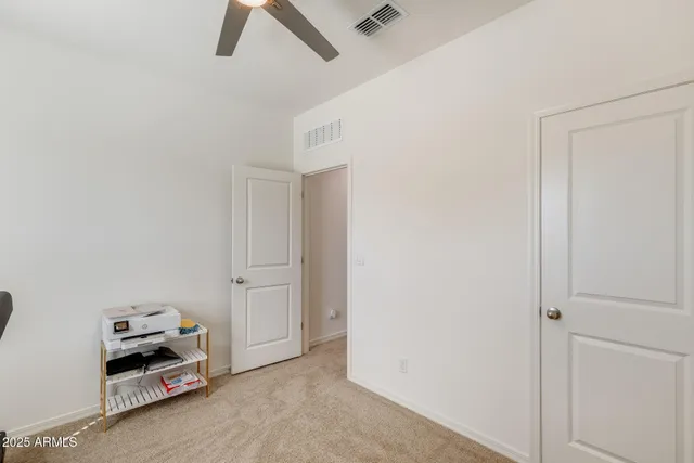 a room with gym equipment and a flat screen tv