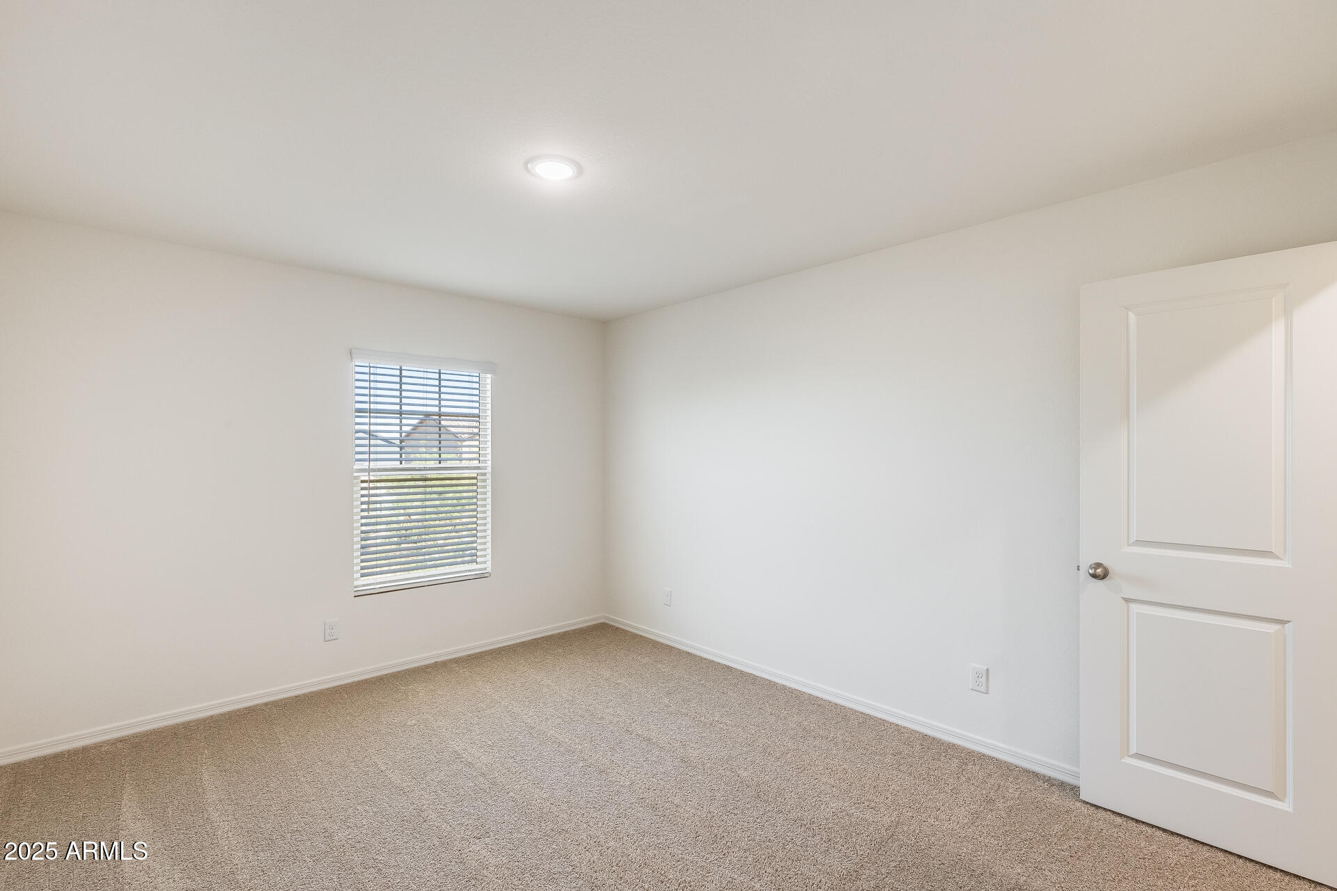 5663 East Moira Road Florence, AZ 85132 - Photo 25 of 37 an empty room with a window