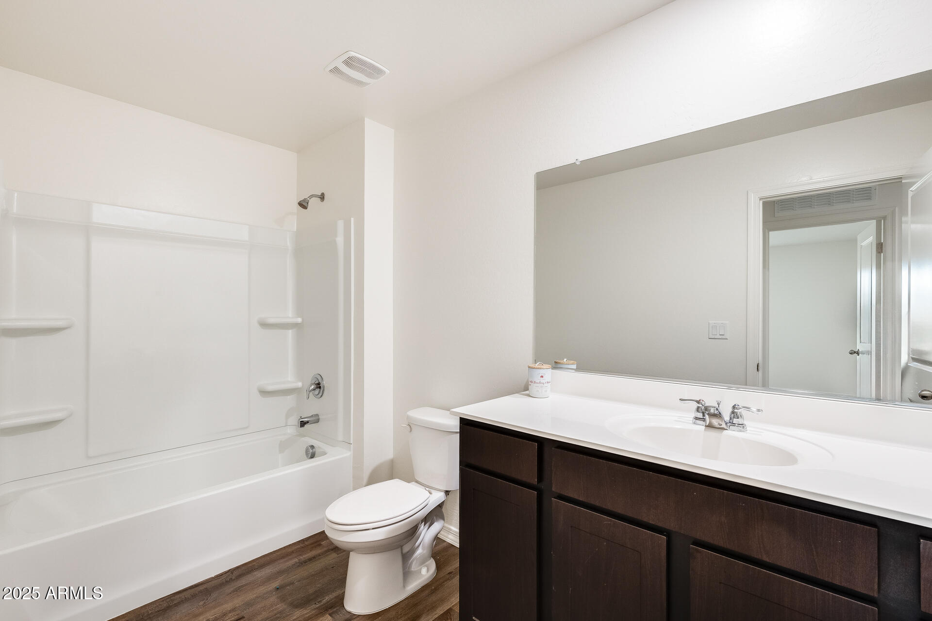5663 East Moira Road Florence, AZ 85132 - Photo 27 of 37 a bathroom with a sink a toilet a mirror and bathtub