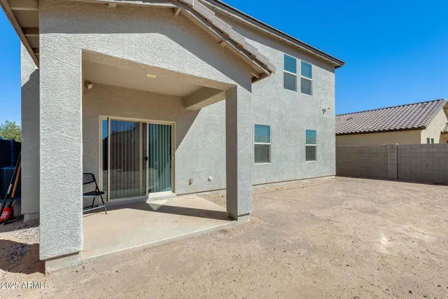 a view of a white house with a outdoor space