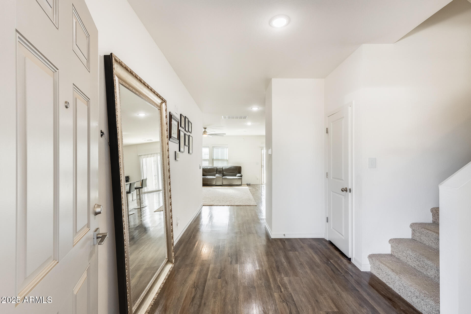 5663 East Moira Road Florence, AZ 85132 - Photo 3 of 37 a view of a hallway with wooden floor