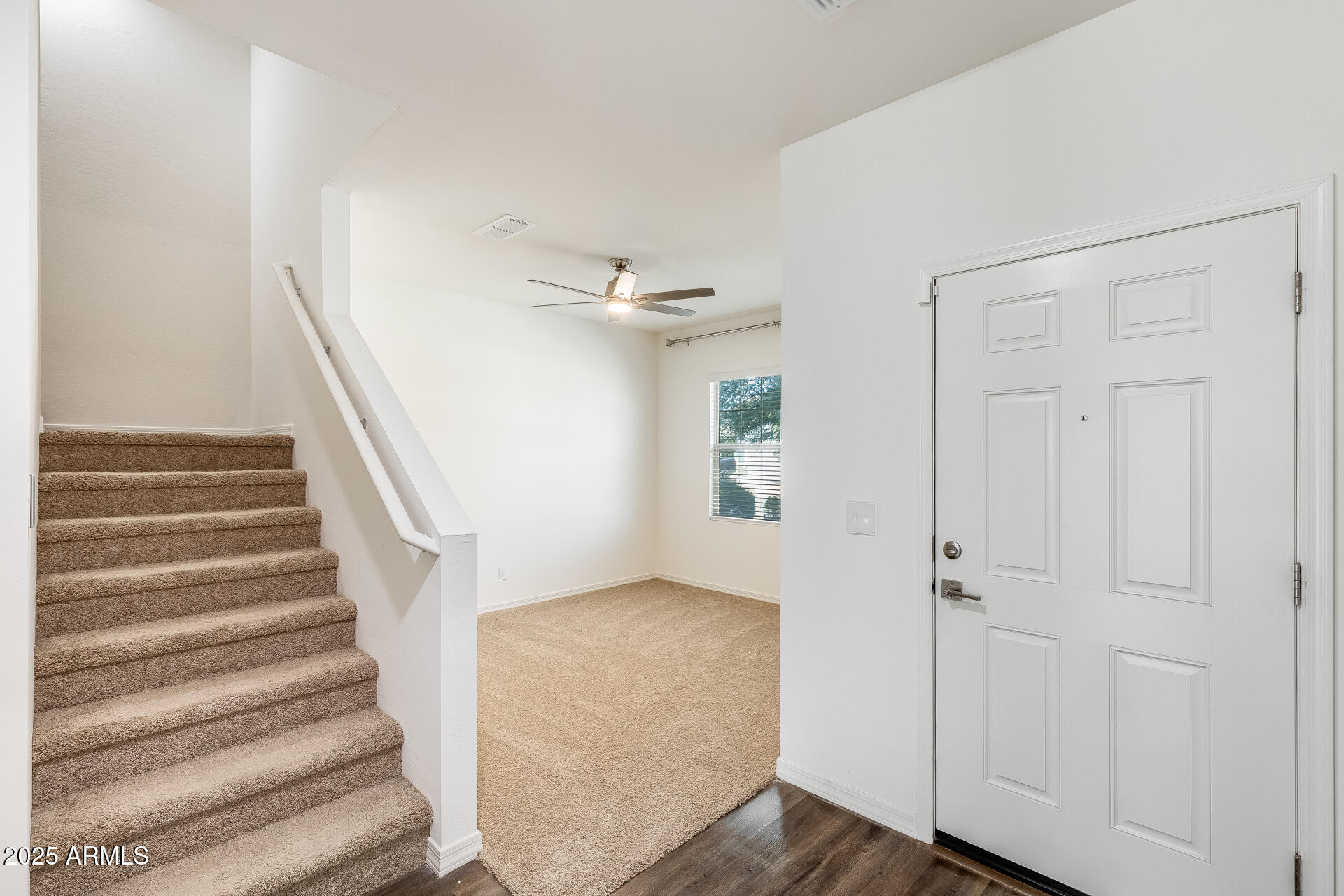 5663 East Moira Road Florence, AZ 85132 - Photo 5 of 37 a view of entryway and hall with wooden floor