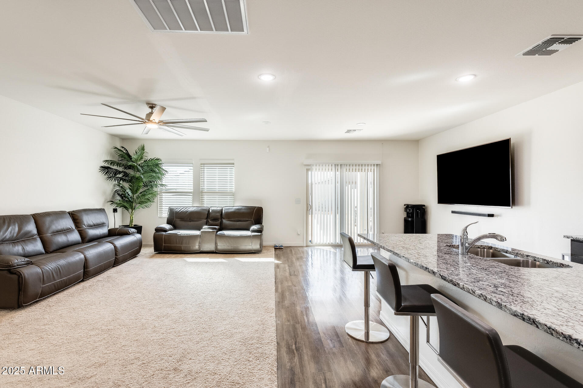 5663 East Moira Road Florence, AZ 85132 - Photo 6 of 37 a living room with furniture and a flat screen tv