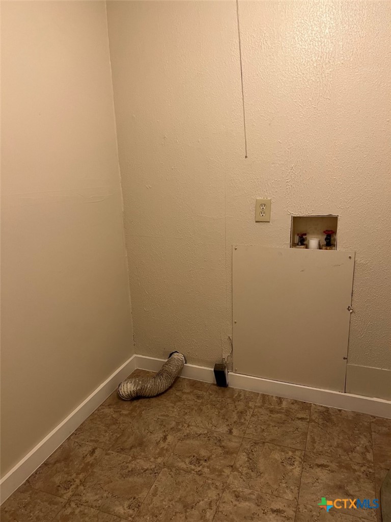 225 Lamar Street Luling, TX 78648 - Photo 12 of 12 a view of a room with racks on the wall